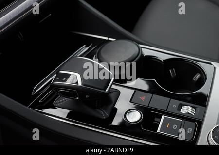 A fragment of the modern car saloon and a gearbox in an expensive car. Stock Photo