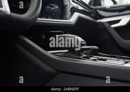 A fragment of the modern car saloon and a gearbox in an expensive car. Stock Photo
