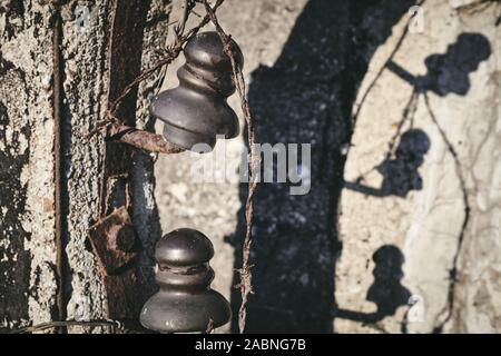 Close up picture of old rusty barbed wire, selective focus, color toning applied. Stock Photo