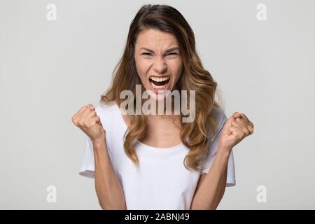 Angry mad hysterical woman screaming, negative emotions Stock Photo
