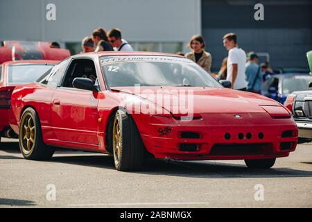 KYIV-28 JULY,2019: JDM car show outdoor.Tuned Japanese drift cars expo in summer.Lowered Nissan 240SX car in red paint Stock Photo