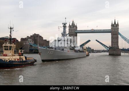 Soil from 70 battle fields of Flanders being shipped into London, passing through the open Tower Bridge where it will form an iconic memorial garden at the  Guards Museum marking the centenary of the Great War in 2014. Stock Photo