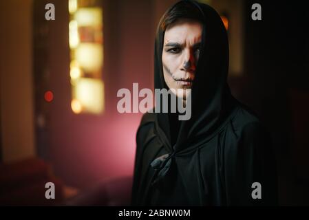 Close-up portrait of a beautiful man's face with Halloween make-up Stock Photo
