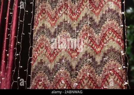 print texture red with white oriental pattern on fabric. Stock Photo