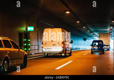 Vienna, Austria - Jul 21, 2011: Multiple cars vans driving fast in Austrian tunnel near the exit Stock Photo