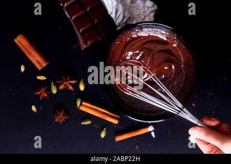 Food Concept Preparation process for melting organic chocolate for make the dessert Chocolate truffle, brownies or cake Stock Photo