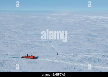 Russia. Aerial view of Russian nuclear icebreaker, 50 Years of Victory breaking throug pack ice in High Arctic at 85.6 degrees north on the way to the Stock Photo