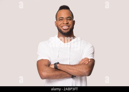 Smiling African American man with arms crossed looking at camera Stock Photo