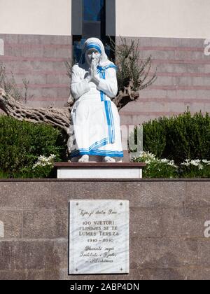 Tirana, Albania - September 29, 2019: Statue of a seated, praying Mother Teresa wearing a white habit with blue stripes. The statue is located at St. Stock Photo