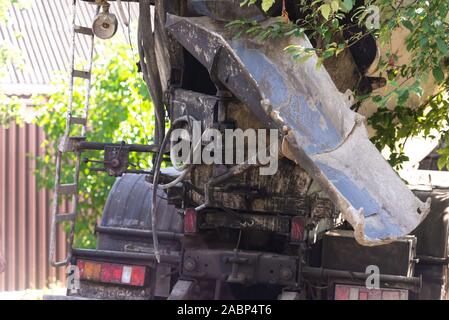 Car with concrete mixer. Tray for draining concrete from a mobile mixer. Stock Photo