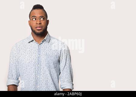 Thoughtful African American man looking aside at copy space Stock Photo