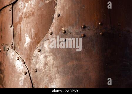 Rusted steel plates joined with rivets Stock Photo