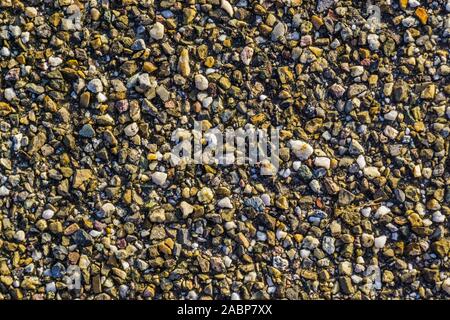 many pebble rocks cemented together in closeup, architecture and decorative background Stock Photo