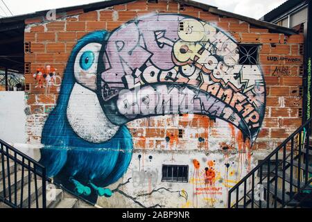 MEDELLIN, COLOMBIA - SEPTEMBER 12, 2019: Street art of Comuna 13 in Medellin, Colombia. Once known as Colombias most dangerous barrio, today graffiti Stock Photo