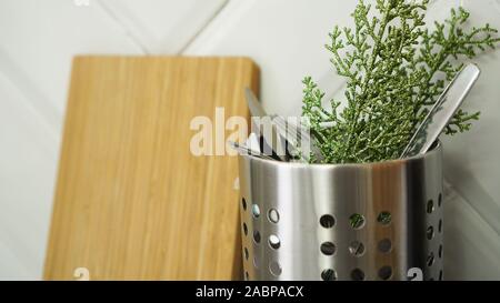 Christmas Background. Minimalistic design. Copy Space. Cutlery in the kitchen in a can Stock Photo