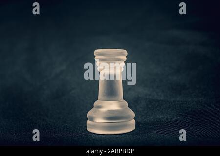 Frosted Rook chess piece on dramatic background Stock Photo - Alamy