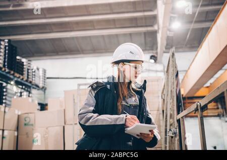 Young female engineer of large industrial plant Stock Photo
