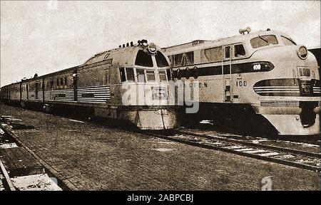 An historical  1947 photograph of 'Iron Horses' - Left is America's first streamlined diesel train (The Burlington Zephyr), and right,a 5400  Burlington goods diesel of the time. Stock Photo