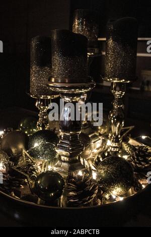 A Decorative Plate Or Tablet With Golden Candlesticks Of Various