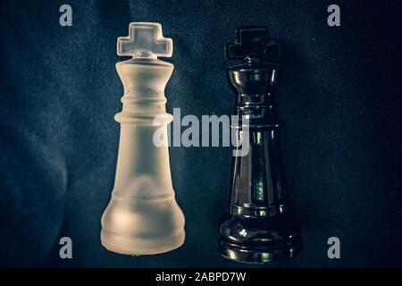 Black and white glass Kings chess pieces Stock Photo
