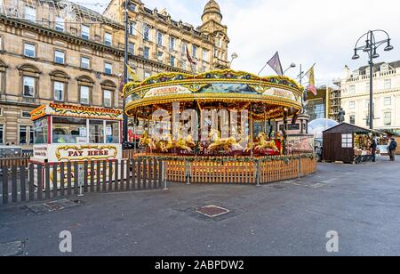 Carousel ride at Glasgow Christmas Market 2019 in George Square Glasgow Scotland with stalls Stock Photo