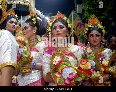 KUTA, INDONESIA - MARCH, 16, 2018: balinese girls waiting for the hindu new year parade at kuta in indonesia Stock Photo