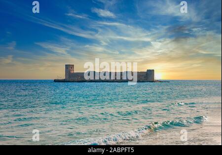 Historical, Ancient Kizkalesi, Kiz Kalesi or Maiden's Castle with Korykos Ruins in Mersin Beach from Turkey near Mediterranean Sea. Stock Photo