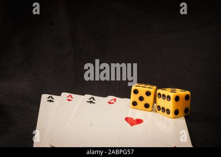 playing cards and dice on black background Stock Photo