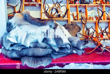 Reindeer fur horns on Christmas Market in Rovaniemi Finland Lapland reflex Stock Photo