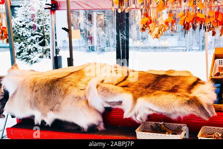 Winter Saami Souvenirs such as reindeer fur and horns reflex Stock Photo