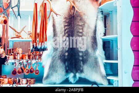 Winter Saami Souvenirs such reindeer fur and horns reflex Stock Photo