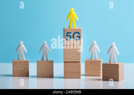 Human Figure Over Stack Of Blocks With 5g Text Showing Comparison Of Network Against Stock Photo