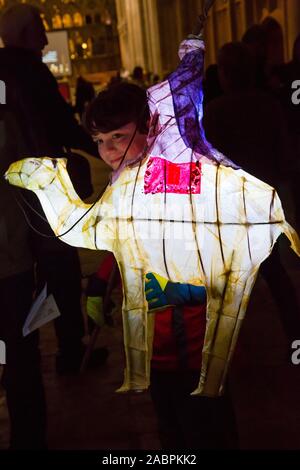 Winchester, Hampshire, UK. 28th November 2019. Crowds flocks to Winchester for the Winchester Christmas Lantern Parade, to show the wonderful lanterns they have created or to watch the parade which starts and finishes at Winchester Cathedral.  Credit: Carolyn Jenkins/Alamy Live News Stock Photo