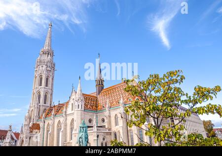 Amazing Matthias Church in Budapest, Hungary. Roman Catholic church in the Gothic style. Located in front of Fishermans Bastion in Buda Castle District. Major Hungarian tourist attraction. Stock Photo