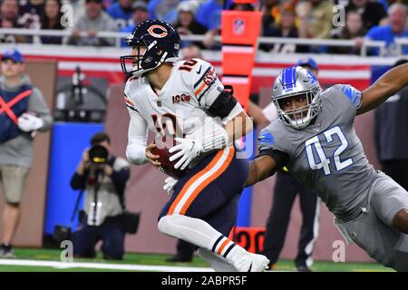 Detroit, Michigan, USA. 28th Nov, 2019. Chicago Bears QB Mitchell Trubisky (10) tries to escape the tackle of Detroit Lions LB Devon Kennard (42) during NFL game between Chicago Bears and Detroit Lions on November 28, 2019 at Ford Field in Detroit, MI (Photo by Allan Dranberg/Cal Sport Media) Credit: Cal Sport Media/Alamy Live News Stock Photo