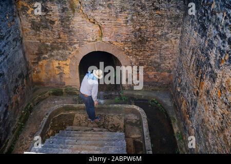 Visitor at the Officers’ Baths in the Kingston and Arthur’s Vale Historic Area, one of the eleven sites making up the Australian Convict Sites World H Stock Photo