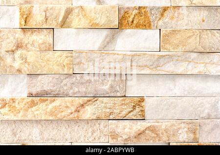 Natural Stone Cladding Mosaic Tile Wall .Old stone facade, seamless pattern . Top view, copy space. Stock Photo