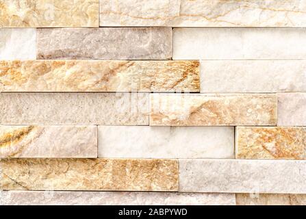 Natural River Stone Cladding Mosaic Tile Wall .Old stone facade, seamless pattern . Top view, copy space. Stock Photo
