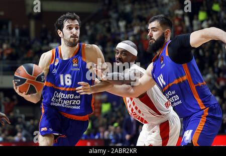 Belgrade. 28th Nov, 2019. Crvena Zvezda's Lorenzo Brown (C) vies with Valencia's Bojan Dubljevic (R) and Guillem Vives during regular season round 11 Euroleague basketball match between Crvena Zvezda and Valencia in Belgrade, Serbia on Nov. 28, 2019. Credit: Predrag Milosavljevic/Xinhua/Alamy Live News Stock Photo