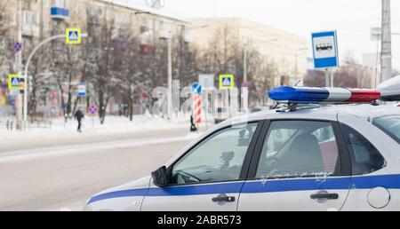 traffic police car with photo and video recording stands for observation in front of the city pedestrian crossing in the winter Stock Photo