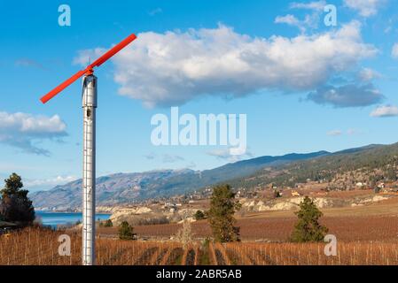 Wind machine in vineyard in autumn on the Naramata Bench near Penticton Stock Photo