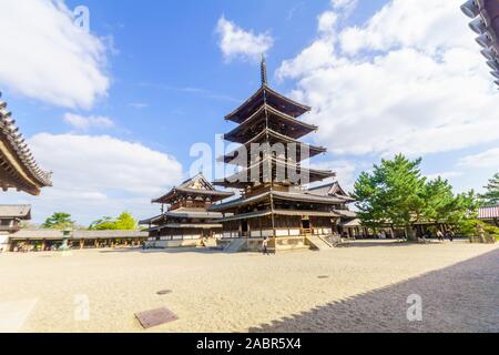 Ikaruga, Japan - October 5, 2019: View of the Horyu-ji compound and pagoda, with visitors, it is a Buddhist temple in Ikaruga, Nara prefecture, Japan Stock Photo