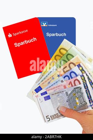 Sparbuch der Sparkasse und Volksbank, Hand mit Euro-Banknoten Stock Photo