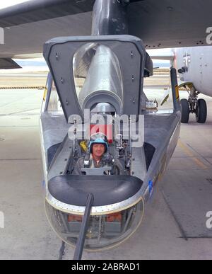 NASA research pilot Milt Thompson sits in the M2-F2 'heavyweight' lifting body research vehicle before a 1966 test flight. The M2-F2 and the other lifting-body designs were all attached to a wing pylon on NASA’s B-52 mothership and carried aloft. The vehicles were then drop-launched and, at the end of their flights, glided back to wheeled landings on the dry lake or runway at Edwards AFB. The lifting body designs influenced the design of the Space Shuttle and were also reincarnated in the design of the X-38 in the 1990s. Stock Photo