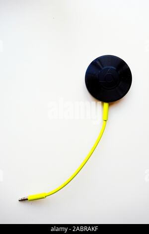 Google Chromecast Audio on White Background Stock Photo