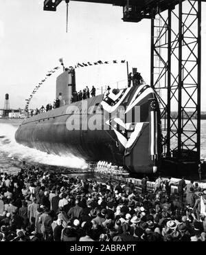 In this file photo taken Jan. 21, 1954, the nuclear-powered submarine USS Nautilus (SSN 571) slips into the Thames River. Stock Photo