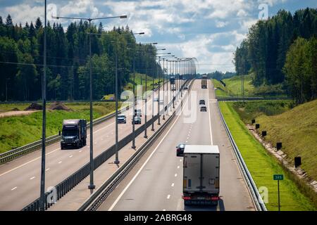 VALDAY, RUSSIA - AUGUST 10,2019: Automobile traffic on the highway M-11 Moscow - St. Petersburg on a summer day. Highway section in the area of Valdai Stock Photo