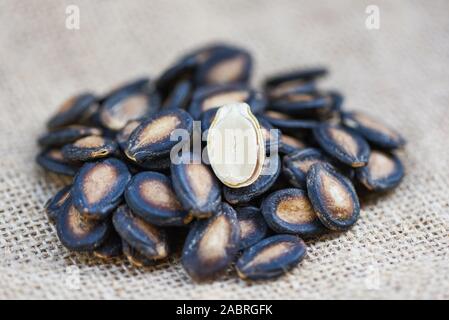 watermelon seeds on sack / close up dried watermelon seed with salt for food or snack Stock Photo
