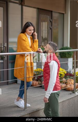 Pleasant conversation. Positive nice couple enjoying the time together while talking to each other Stock Photo