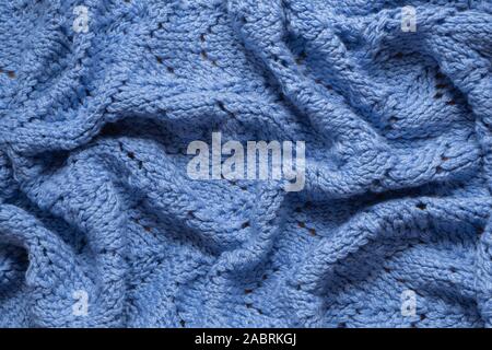 Blue handmade woolen knitted blanket background Stock Photo